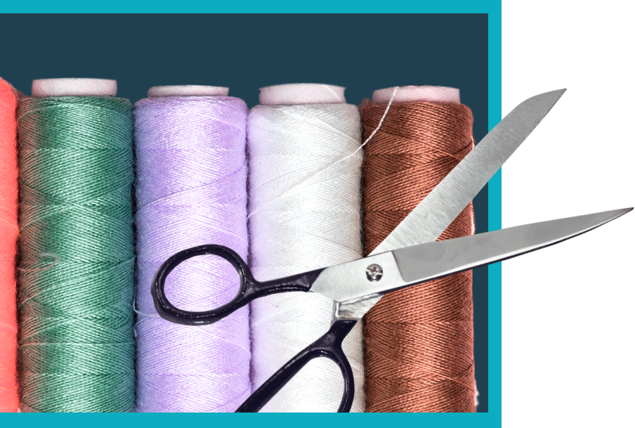 thread spools with different colours like green, pastel purple, white/ivory and brown/copper