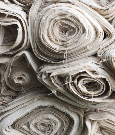 beige rolled up fabric